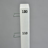 A white vertical pole from the Hobby Horse LarDen Jump 120 cm / 47 inch set, featuring black numbers 120 and 110 and two metal hooks on the side, stands against a plain gray background.