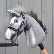 LarDen Hobby Horse Flint, a grey plush horse with a light grey and black mane wearing a black halter