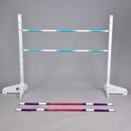 The Hobby Horse LarDen Jump 120 cm / 47 inch with Extra Poles set features a white adjustable stand holding two blue and white striped rails, plus red and purple poles on a grey floor. Perfect for Hobby Horsing, with a plain grey background.