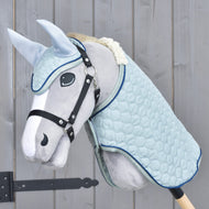 Light blue quilted blanket and ear bonnet set worn by a grey Hobby Horse