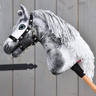 Hobby Horse Rosie in left profile, showing the black halter and white yarn mane