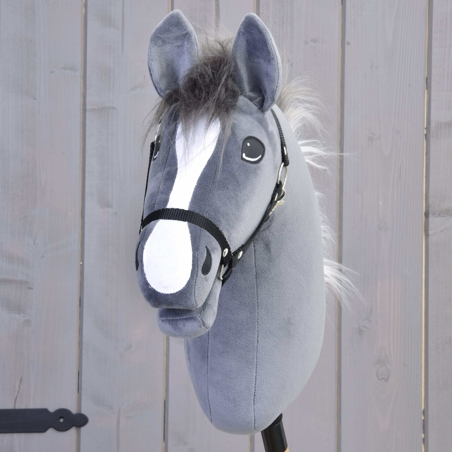 Hobby Horse Beauty with Black Halter in soft gray fabric with white blaze and playful stitched eyes on wooden stick