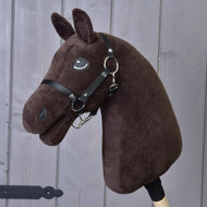 The Build your horse by related_to_12441055625556 features a dark brown plush head with black bridle and reins on a wooden stick—perfect inspiration to create your own custom hobby horse.