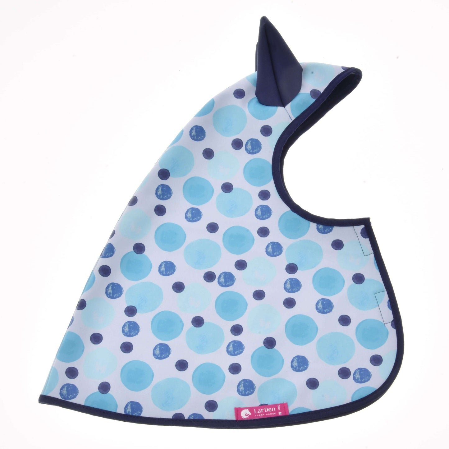 The Raincoat Bubbles bib by Hobby Horse LarDen has blue and teal polka dots, dark trim, a pointed ear-like top detail, and a rounded shape with a small pink tag—perfect for kids who love hobby horse style.